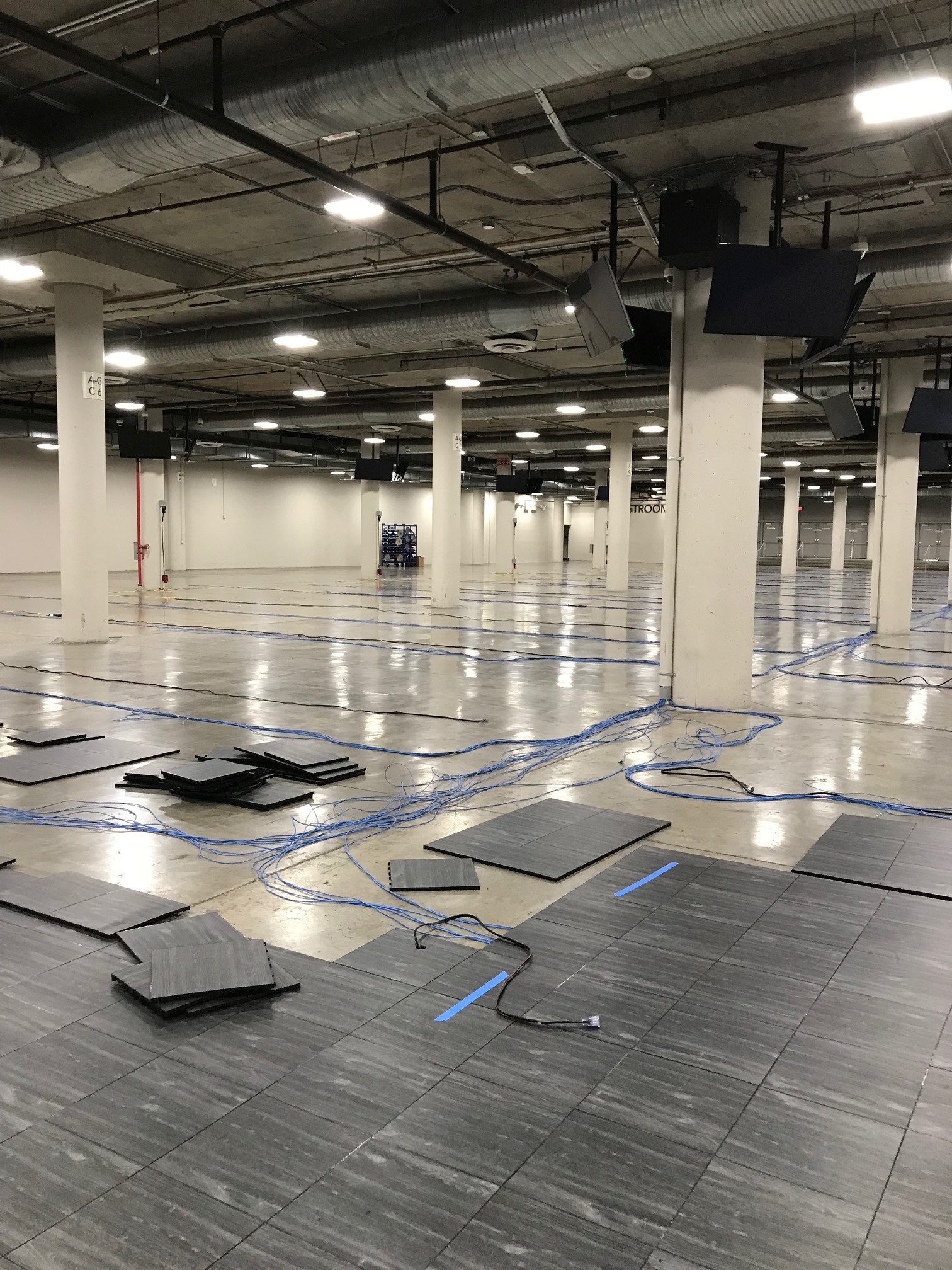 Setting up flooring at a trade show